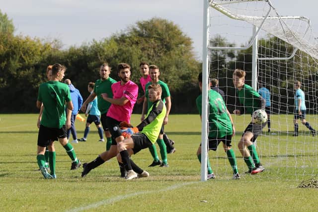Freehouse (pink) score one of their goals during their 6-1 Portsmouth & District FA Sunday Intermediate Cup win against Shelford Rovers. Pic: Kevin Shipp.