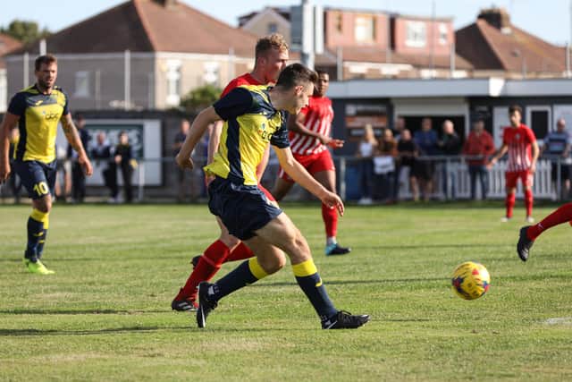 Tom Dinsmore looks for a pass during Moneyfields' FA Cup win over Camberley. Picture: Chris Moorhouse