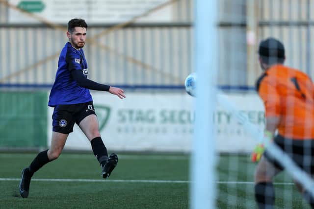 Joe McLean scores Clanfield's second goal. Picture: Chris Moorhouse