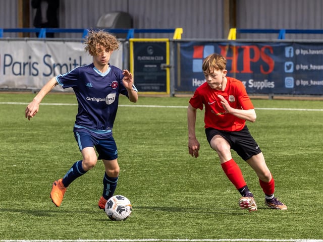 Action from the Under-14 Memorial Challenge Cup final between Pickwick Youth Pumas (all blue kit) and Horndean Youth Red. Picture: Mike Cooter