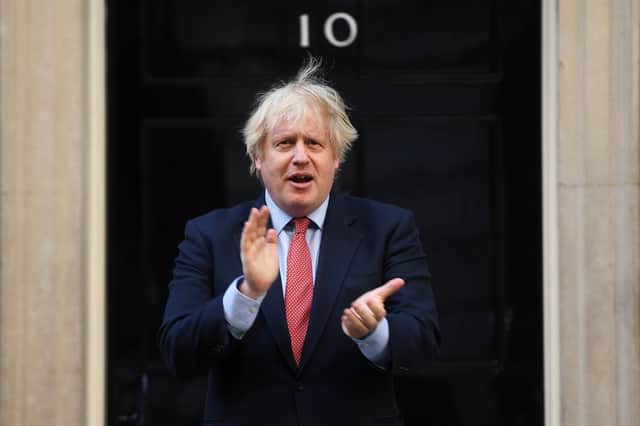 Prime Minister Boris Johnson takes part in the weekly 'Clap for Our Carers' event in Downing Street on May 28, 2020. Photo by Peter Summers/Getty Images