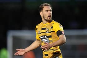 MK Dons have reportedly placed a six-figure sum to secure Cambridge striker Sam Smith.