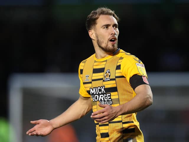 MK Dons have reportedly placed a six-figure sum to secure Cambridge striker Sam Smith.