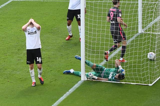 Matt Clarke reacts scoring an own goal for Derby against Leeds. Picture: Laurence Griffiths/Getty Images