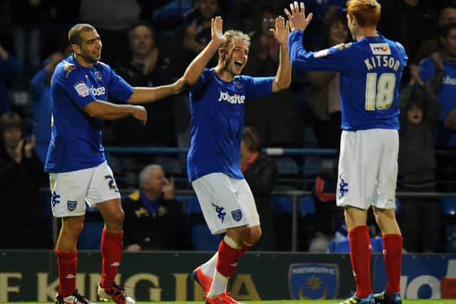 Luke Varney celebrates with Dave Kitson (right) Tal Ben Haim (left) after scoring in Pompey's 2-0 win over Barnsley in October 2011. Picture: Tony Marshall