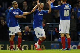Luke Varney celebrates with Dave Kitson (right) Tal Ben Haim (left) after scoring in Pompey's 2-0 win over Barnsley in October 2011. Picture: Tony Marshall