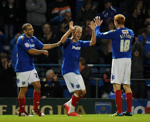Luke Varney celebrates with Dave Kitson (right) Tal Ben Haim (left) after scoring in Pompey's 2-0 win over Barnsley in October 2011. Picture: Tony Marshall