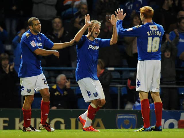 Luke Varney celebrates with Dave Kitson (right) Tal Ben Haim (left) after scoring in Pompey's 2-0 win over Barnsley in October 2011. Picture: Tony Marshall