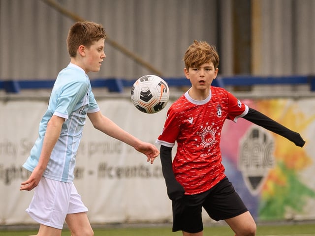 Action from the Portsmouth Youth League Geldard Invitation Cup final between Jubilee 77 U13s and Castle United U13s (light blue and white kit). Picture: Keith Woodland (190321-484)