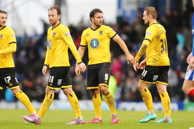 Matt Tubbs netted AFC Wimbledon's second in a 2-0 victory at Fratton Park on Boxing Day 2014 - yet opted to tone down his celebration against the club he was joining. Picture: Joe Pepler