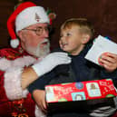 Albie, 3, meets Father Christmas. Leigh Park Christmas grotto at Greywell Shopping Centre, Leigh Park, Havant 
Picture: Chris Moorhouse (jpns 251123-42)