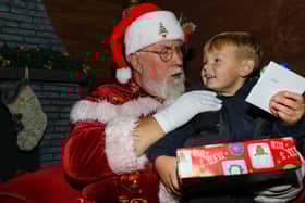 Albie, 3, meets Father Christmas. Leigh Park Christmas grotto at Greywell Shopping Centre, Leigh Park, Havant 
Picture: Chris Moorhouse (jpns 251123-42)