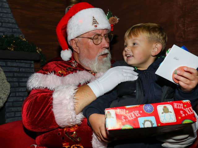 Albie, 3, meets Father Christmas. Leigh Park Christmas grotto at Greywell Shopping Centre, Leigh Park, Havant 
Picture: Chris Moorhouse (jpns 251123-42)