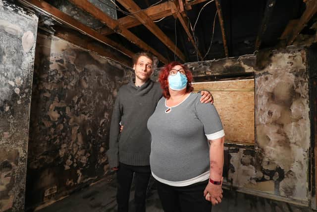 Eve and Michael in Michael's bedroom, where the fire started. Picture: Stuart Martin (220421-7042)