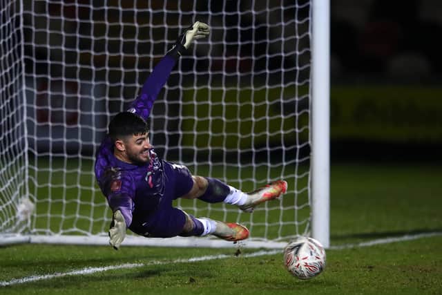 Newport's Tom King saves Neal Maupay's penalty in last month's FA Cup third round encounter with Premier League Brighton. Picture: Michael Steele/Getty Images
