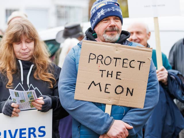 Campaigners stand together during a protest in Droxford on 31 January aimed at stopping 4x4 access to the riverbed