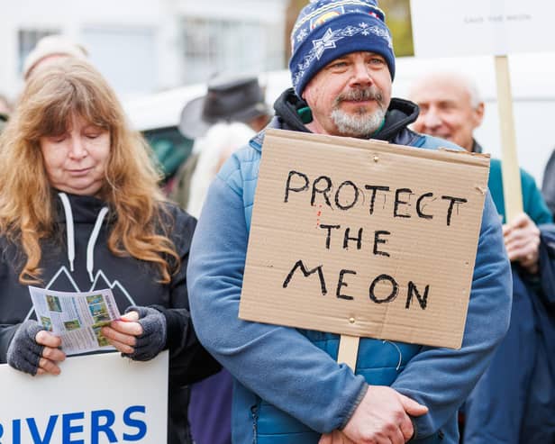 Campaigners stand together during a protest in Droxford on 31 January aimed at stopping 4x4 access to the riverbed