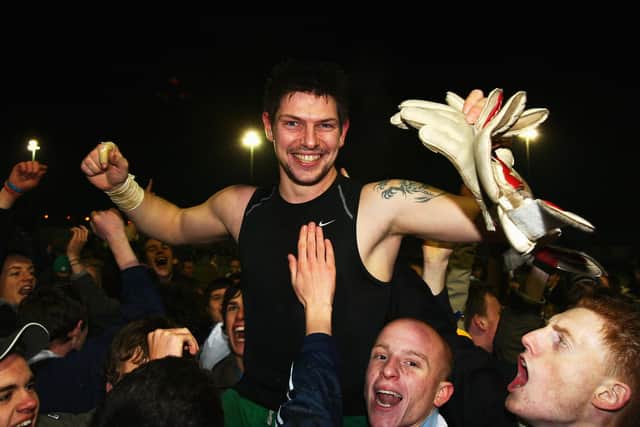 Kevin Scriven is chaired off the pitch by jubilant fans after Hawks' FA Cup replay win over Swansea. Photo by Mike Hewitt/Getty Images.