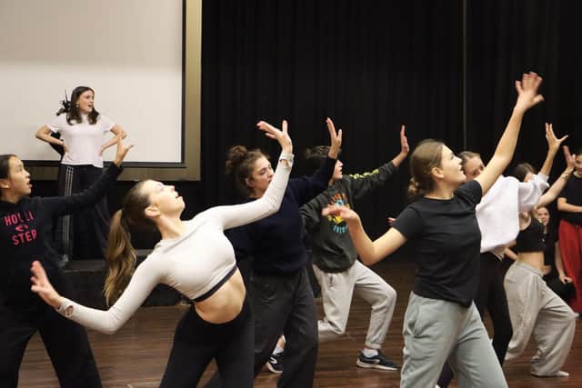 Pupils rehearse one of the musical numbers in the show