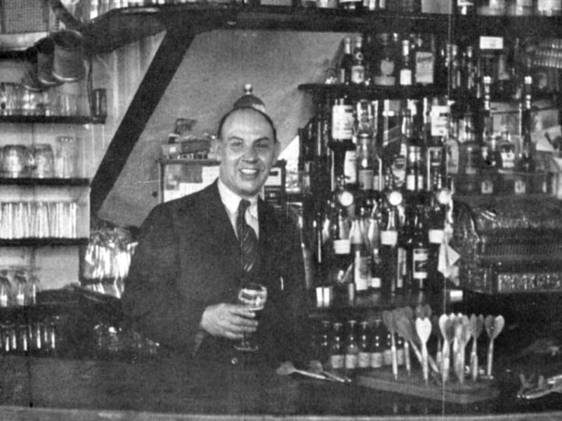 Landlord Alf Woods behind the bar at the Coal Exchange, Old Portsmouth, in the late 1940's