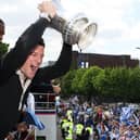 David Nugent lifts the FA Cup during Pompey's open-top bus celebrations. Picture: Joe Pepler