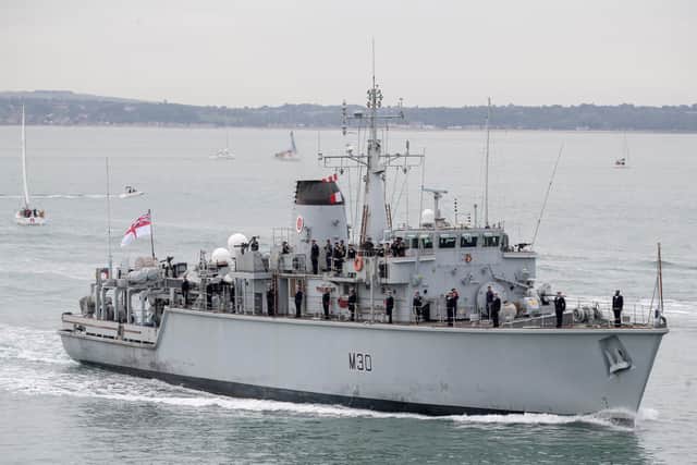 Crew members line the deck of HMS Ledbury as she returns to Portsmouth following a three year deployment to the Gulf. Picture: Andrew Matthews/PA Wire