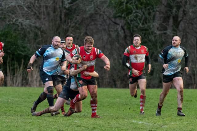 Petersfield's Tom Whitehouse (with the ball) in action during his side's Hampshire Premier win over Fareham Heathens this season. Picture: Vernon Nash
