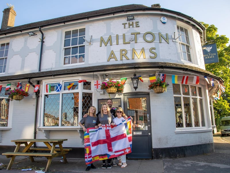England fans gathered at the Milton Arms in Portsmouth on Sunday evening to watch England's opening game against Serbia in Euro 2024.Pictured - Tracey Ford, Landlady Christina Sloan, Landlord Dan Smith and fan Gemma WilliamPhotos by Alex Shute