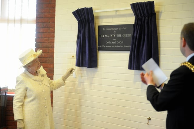 The Queen visits Portsmouth, pictured at the D-Day Museum unveiling a plaque
