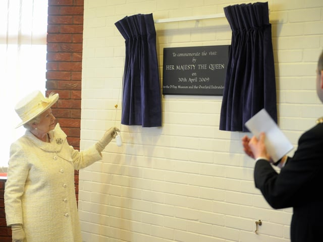 The Queen visits Portsmouth, pictured at the D-Day Museum unveiling a plaque