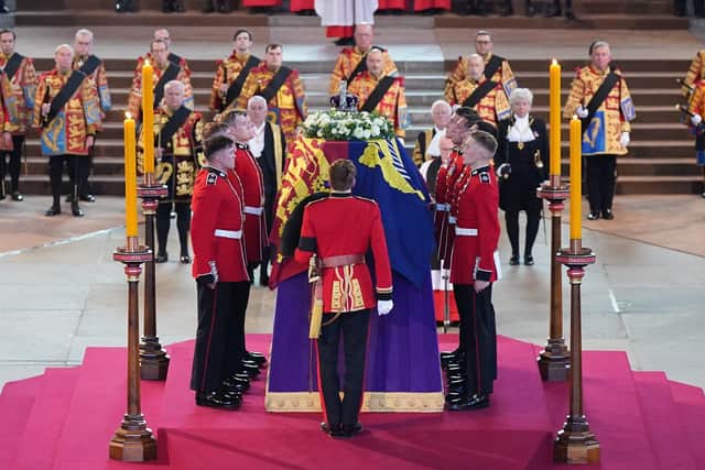 The Bearer Party from Queen's Company, 1st Battalion Grenadier Guards, place the coffin of Queen Elizabeth II on the catafalque Westminster Hall, London, where it will lie in state ahead of her funeral on Monday Picture: Yui Mok - WPA Pool/Getty Images