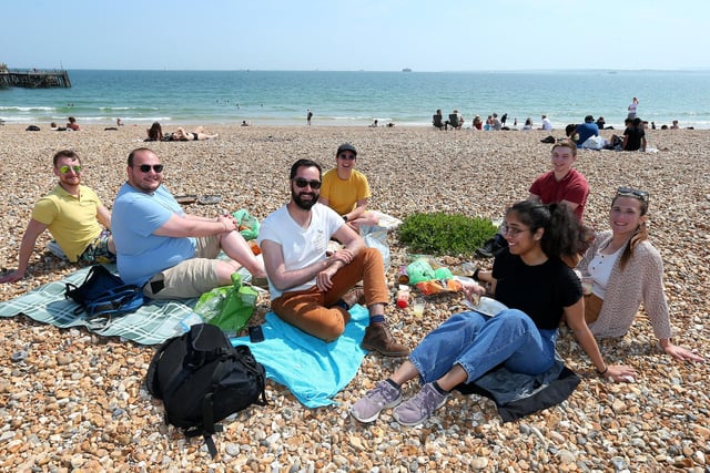 David Gaudin, centre, in white shirt, with friends and colleagues at his leaving party before returning to Paris.