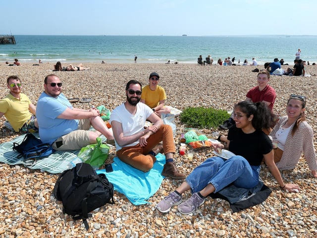 David Gaudin, centre, in white shirt, with friends and colleagues at his leaving party before returning to Paris.