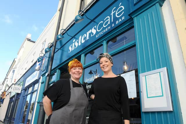 Sisters Sarah and Abby Simmons officially opened Sisters Cafe in Marmion Road, Southsea, on Saturday, October 31.

Pictured is: (l-r) Abby Simmons (39) and her sister Sarah Simmons (36).

Picture: Sarah Standing (021120-7449)