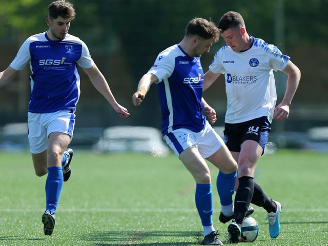 Denmead's Dan Broad, centre, and Clanfield's Fred Penfold, right. Picture: Chris Moorhouse