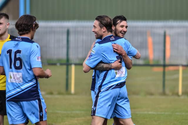 Conor Bailey (middle) is congratulated by Connor Hoare after scoring on his AFC Portchester debut at Hamble Club. Picture: Daniel Haswell.
