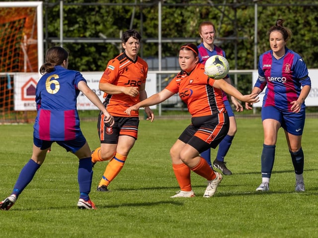 Portchester's Eilidh Currie and Hannah Walker surrounded by USP players. Picture: Mike Cooter