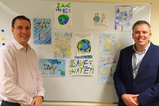WATER WALL: Artwork by pupils at Bosmere Junior School, Havant, near Portsmouth. Their creative inspiration will grace a boundary wall of Southern Water Framework Contractor Trant BTU, which is headquartered at Southmoor Lane, Havant. BTU is owned by Trant Engineering. From left, Trant Engineerings James Henderson, Director  Process and Water, and David Graham, General Manager, Trant Engineering. 