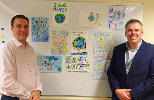 WATER WALL: Artwork by pupils at Bosmere Junior School, Havant, near Portsmouth. Their creative inspiration will grace a boundary wall of Southern Water Framework Contractor Trant BTU, which is headquartered at Southmoor Lane, Havant. BTU is owned by Trant Engineering. From left, Trant Engineerings James Henderson, Director  Process and Water, and David Graham, General Manager, Trant Engineering. 