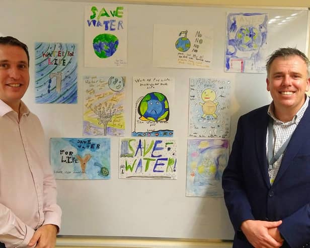 WATER WALL: Artwork by pupils at Bosmere Junior School, Havant, near Portsmouth. Their creative inspiration will grace a boundary wall of Southern Water Framework Contractor Trant BTU, which is headquartered at Southmoor Lane, Havant. BTU is owned by Trant Engineering. From left, Trant Engineerings James Henderson, Director  Process and Water, and David Graham, General Manager, Trant Engineering. 