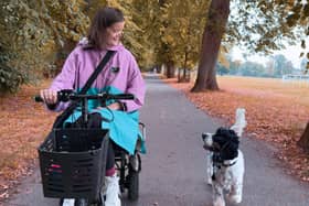 Lucy, who is profoundly deaf, out and about with her hearing dog Wilbur.