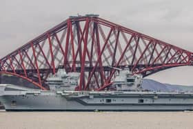 HMS Queen Elizabeth makes her way under the Forth Bridges as she prepared to dock at Rosyth in March  (Pic:Katielee Arrowsmith / SWNS)