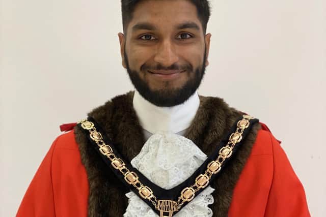 Prad Bains wearing his mayoral robes and chains.