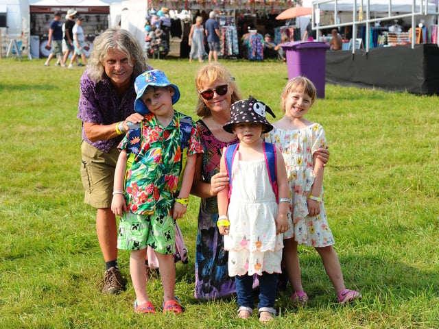 Wickham Festival 2024 got underway at their new arena site in Shedfield on Thursday, August 1. Pictured is: Helen and Vic Grout from Wrexham, North Wales with (l-r) Killian (8), Maizie (5) and Lilith (7).Picture: Sarah Standing (010824-2962)