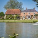 This property comes with nine bedrooms, seven bathrooms and five reception rooms.