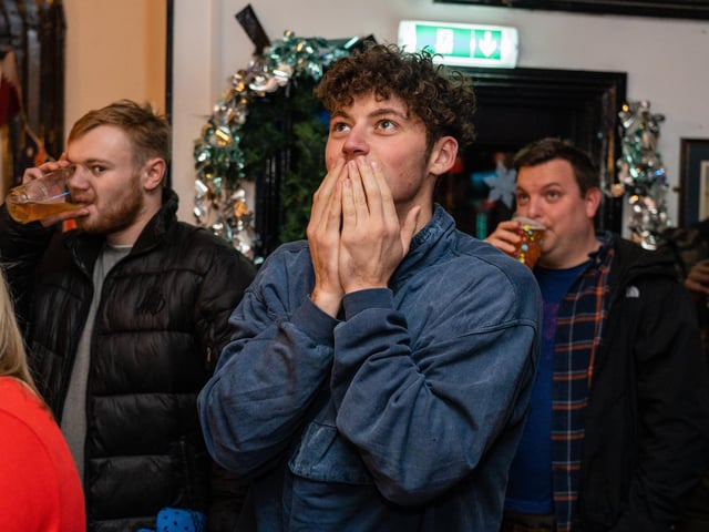 England fans at The Kings in Southsea as Harry Kane makes his run up for the second penalty against France. Picture: Matthew Clark