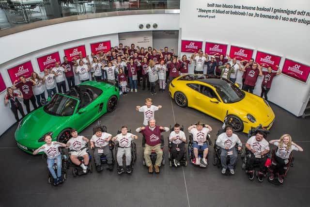 Michael with volunteers at the Porsche Muscle Dream Driving Experience Programme in 2022.