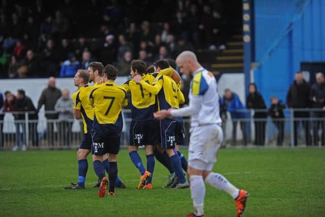 Gosport players celebrate after Hawks defender Lee Molyneaux (foreground) had put through his own goal on Boxing Day, 2015. Picture by  Ian Hargreaves.