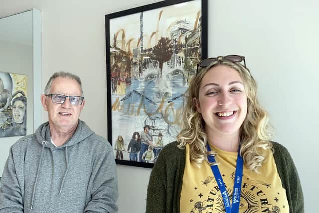Rope Quays management company directo,r Ken Huzzey, and St Vincent College art teacher, Chloe Cusse, with a student’s artwork on display in one of the lobbies at the harbourside development.