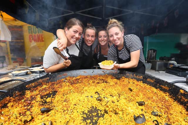Southsea Food Festival at Palmerston Road,  Southsea, during it 10th anniversary. Pictured are:   Daniella Thoms, Lizzie Thoms, Nadine Connelly and Holly Murphy of Mr G's Seafood shack serving  Seafood Paella.
Photo:Habibur Rahman